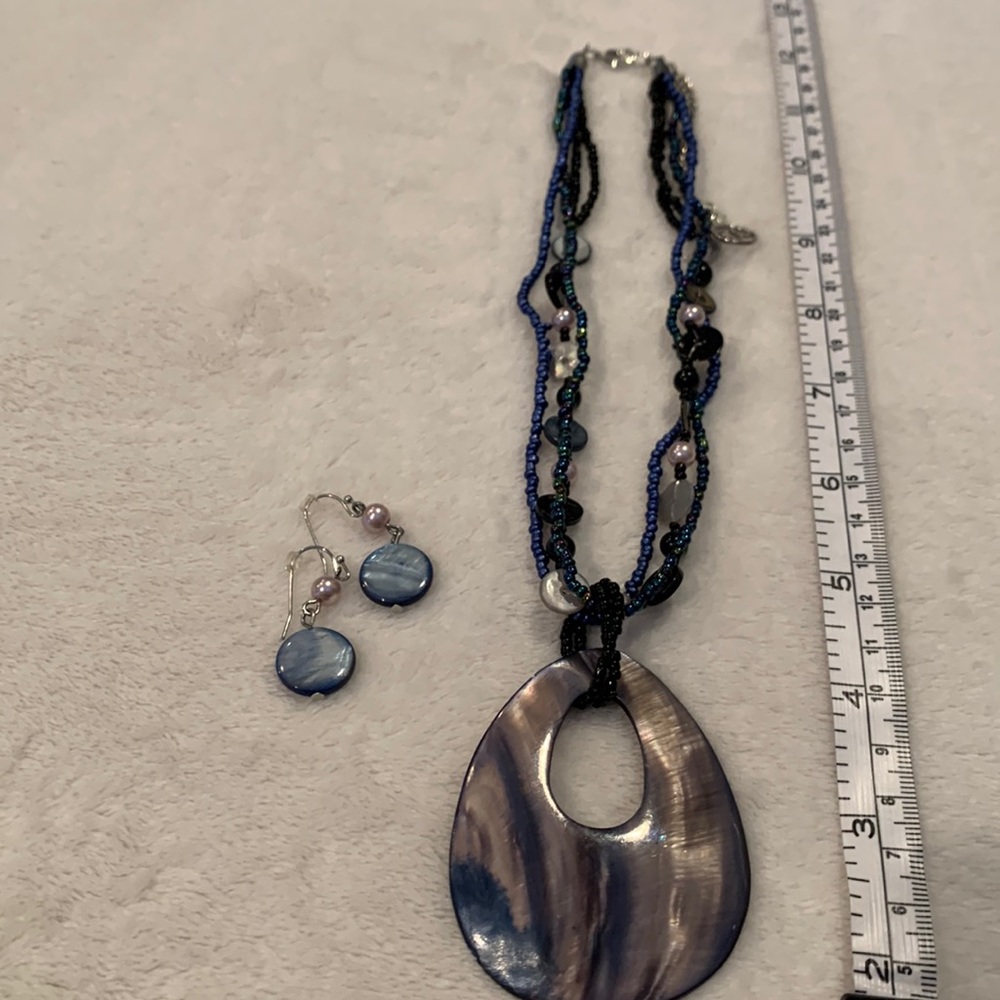 Blue iridescent beaded necklace with pendant and earrings